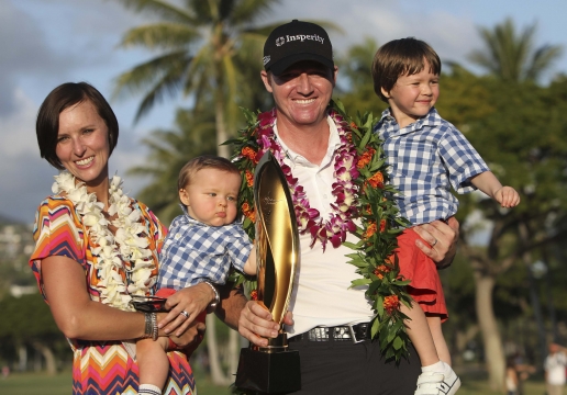 Jimmy Walker of the U.S. celebrates with his family..