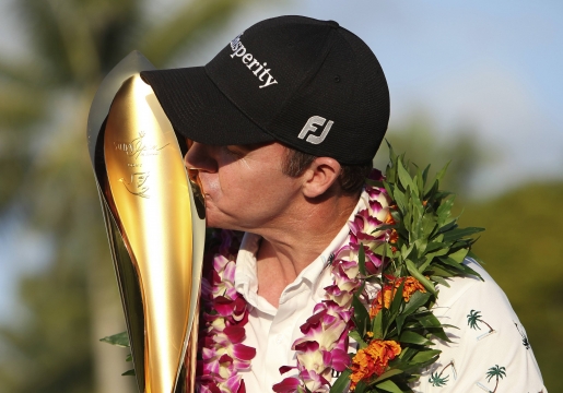 Jimmy Walker of the U.S. celebrates by kissing..